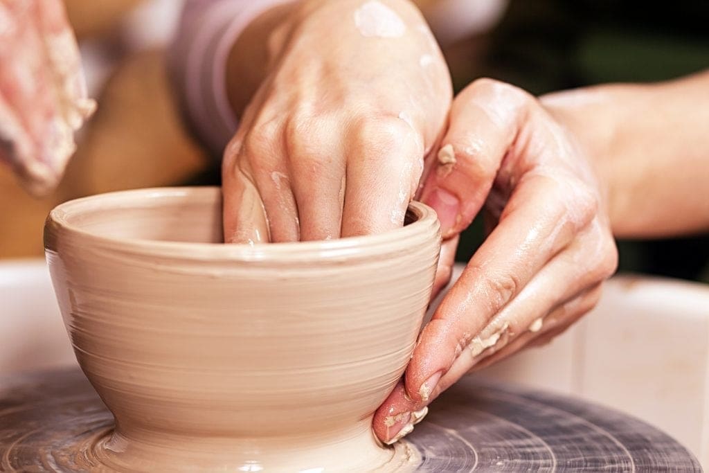 Close-up of a woman potter sclulpt clay