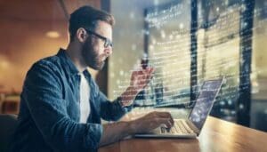 developer in a coffee shop working on developing a code editor with code symbols in the air