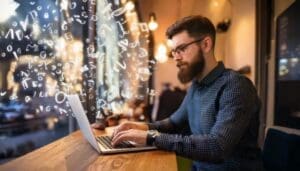 developer working at a coffee shop with fonts floating around his head