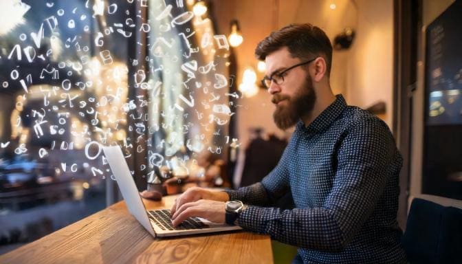 developer working at a coffee shop with fonts floating around his head